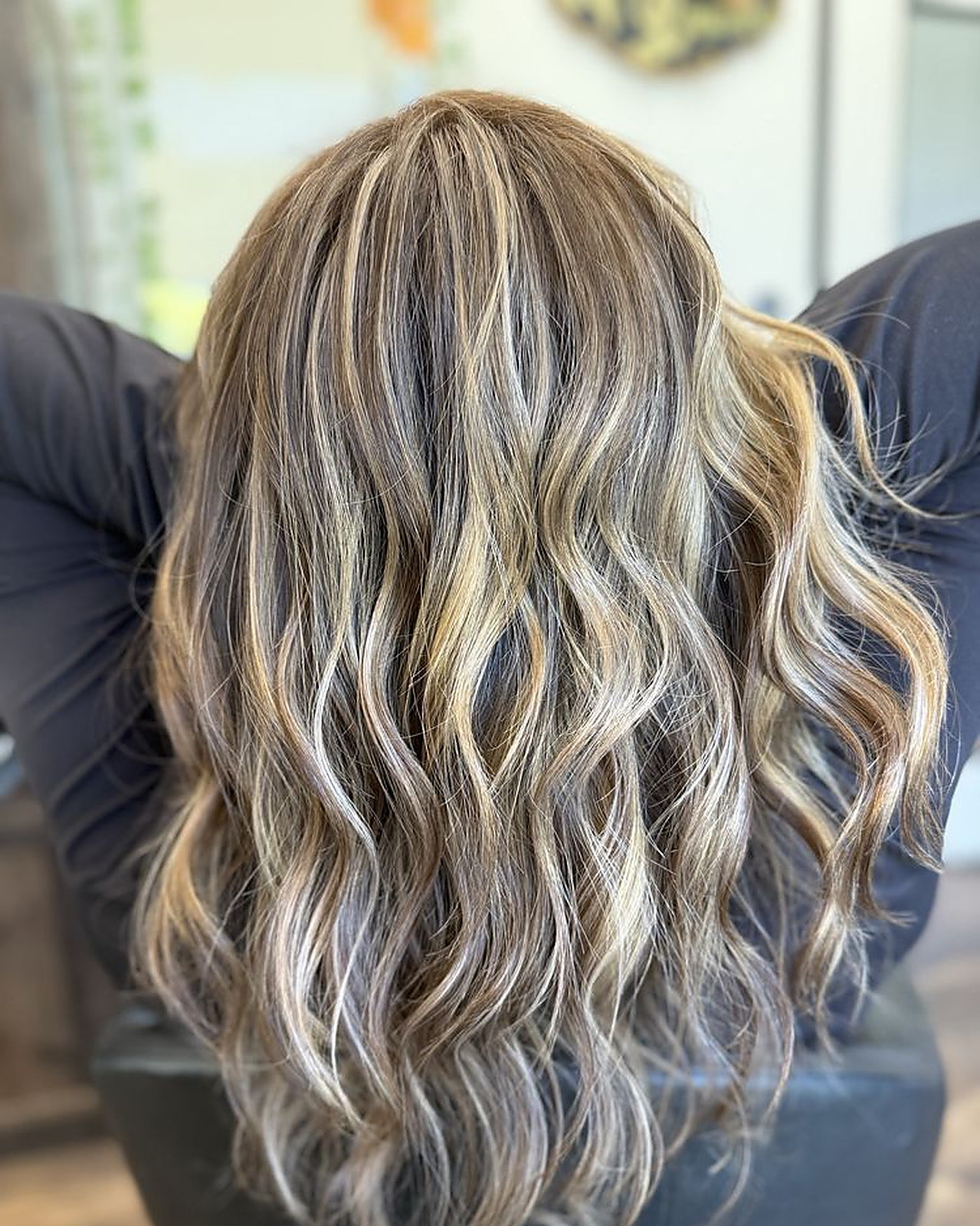 Dimensional bronde with a blended root and face-framing highlights
