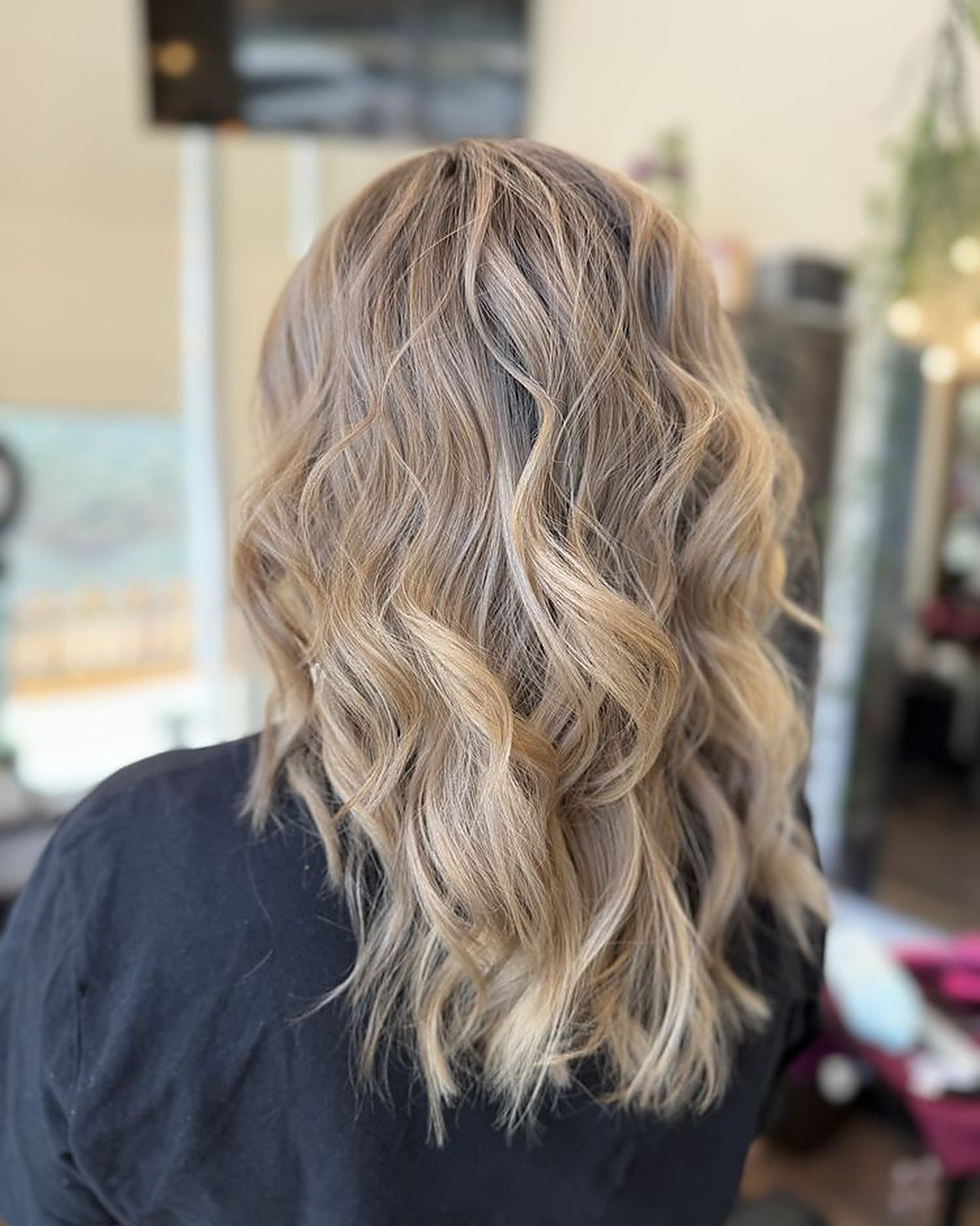 Beige blonde lob with a shadow root