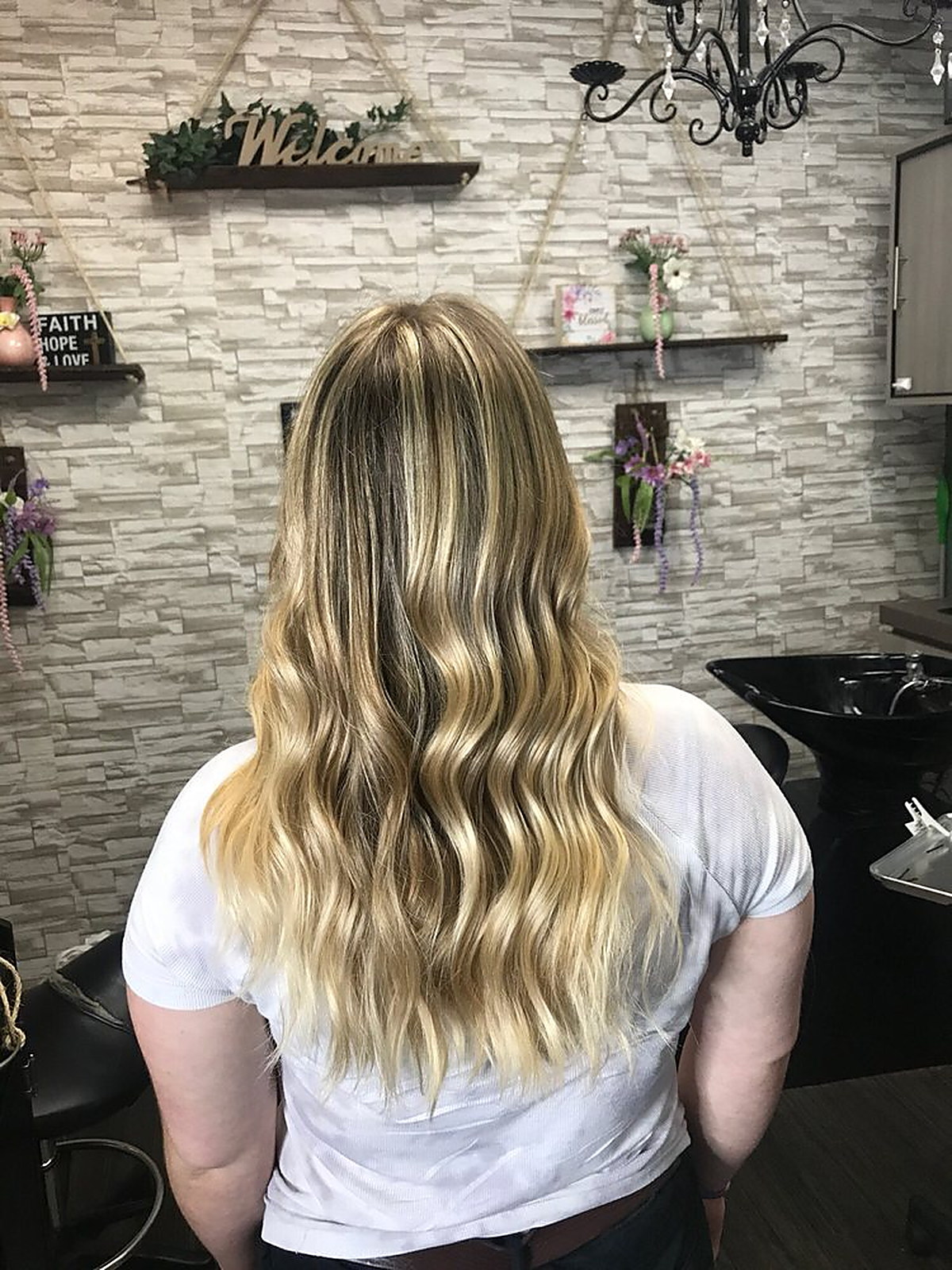 Bright blonde balayage on long waves